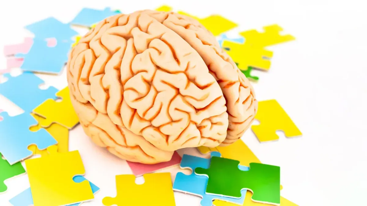 Scientist using vibration device on a participant's leg during exercise study