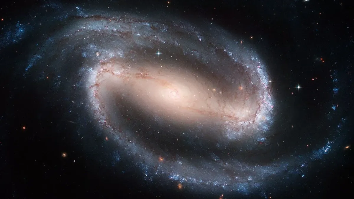 An artist's illustration of the barred spiral galaxy COSMOS-74706 as observed 11.5 billion years ago, with a central bar structure funneling gas toward its core.