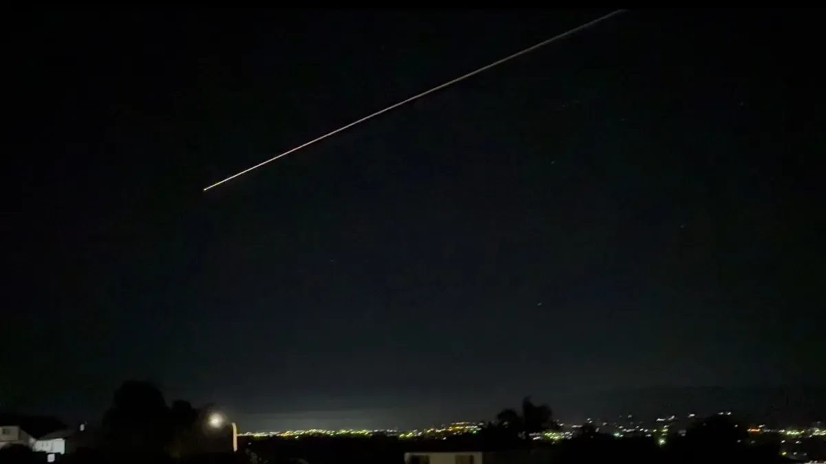 SpaceX Dragon capsule re-entry over California with plasma glow and sonic boom